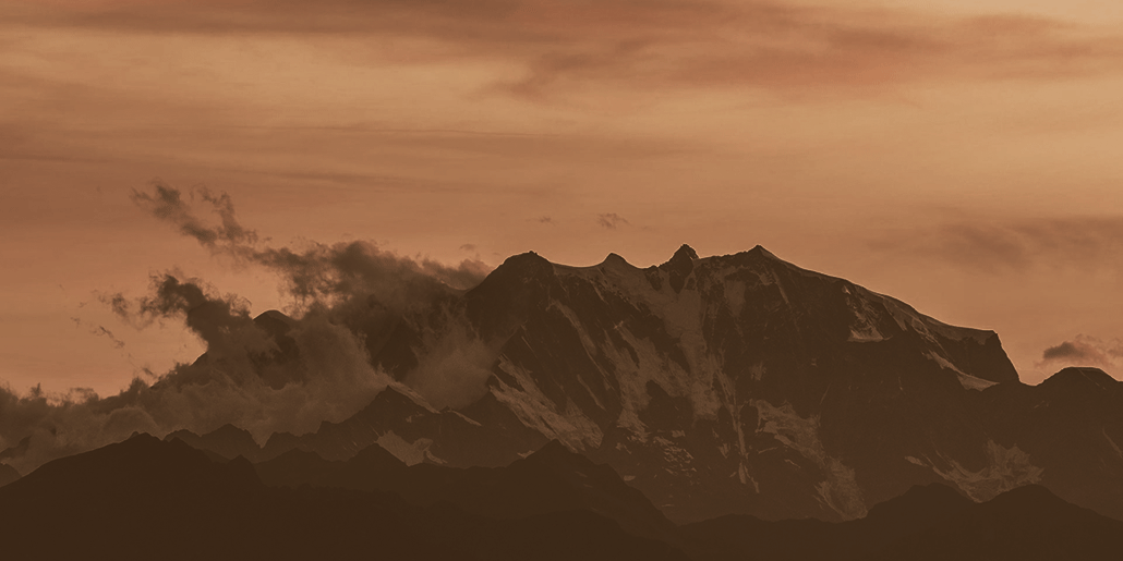 dark mountains with orange sky